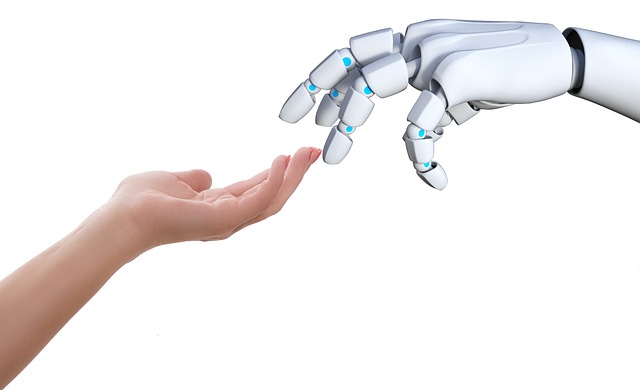 Human and robot hands reach for eachother